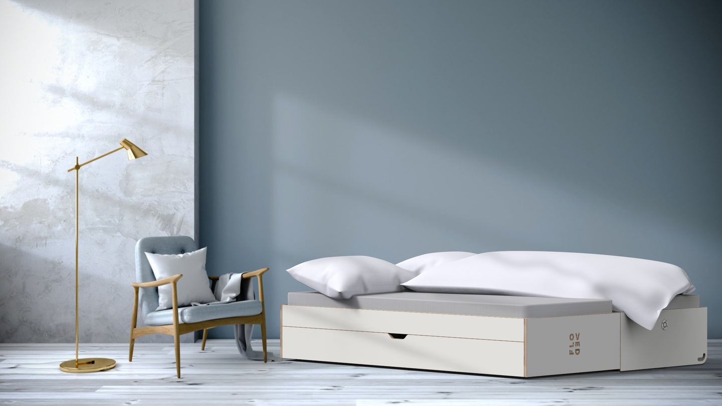 The FLOVED sofa bed unfolded in a room
